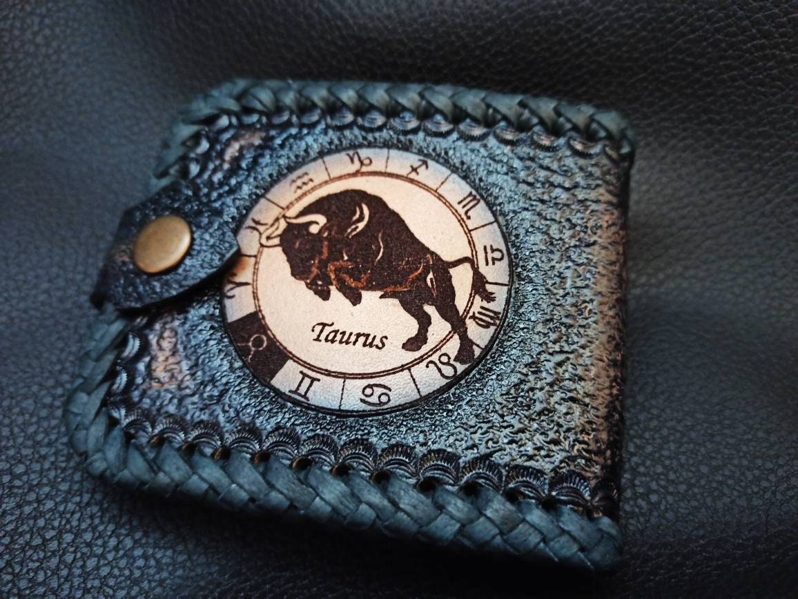 Leather handcrafted wallets for men, personalized with the zodiac symbols and the initials of the owner.